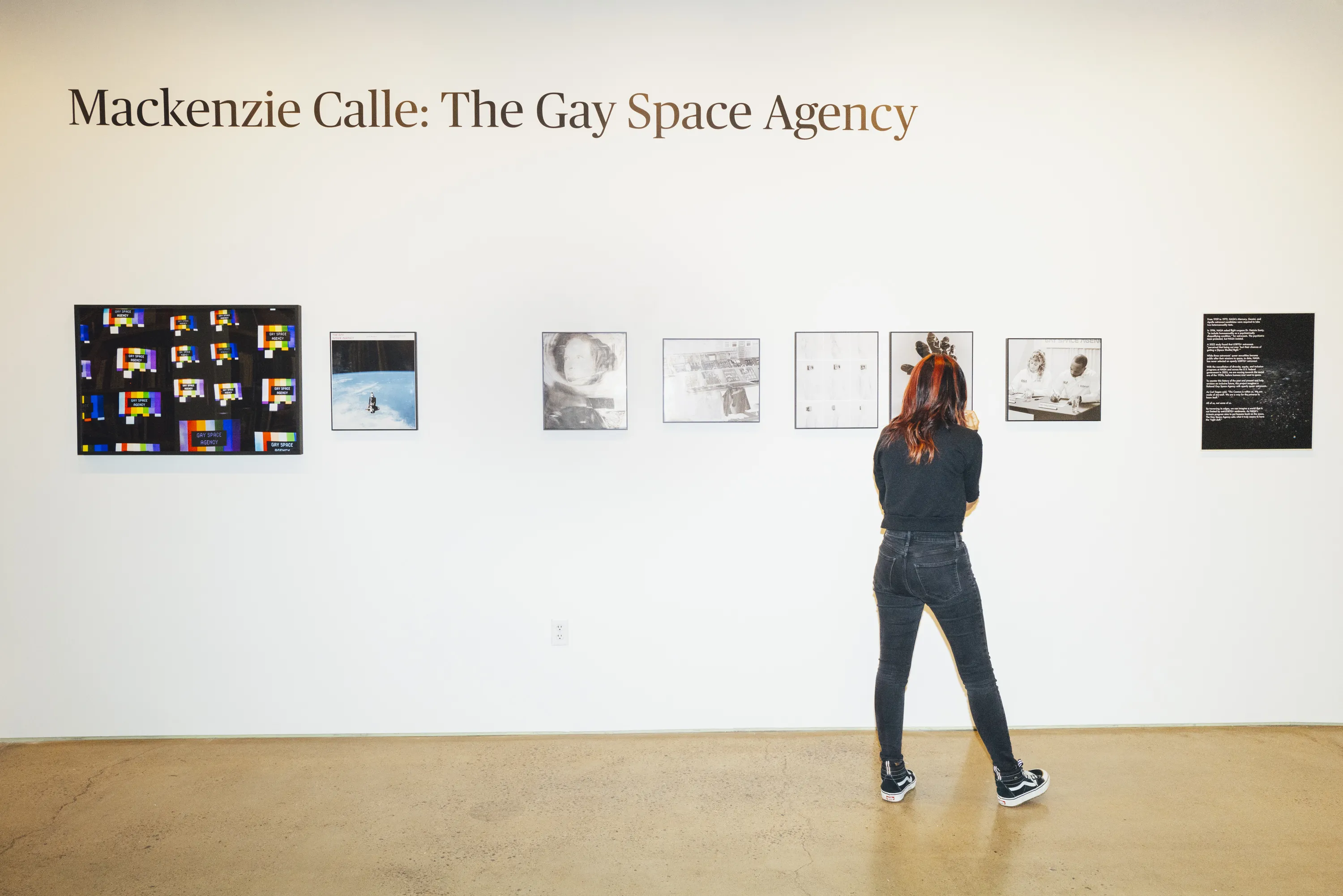 visitor viewing the gay space agency in icp's lobby